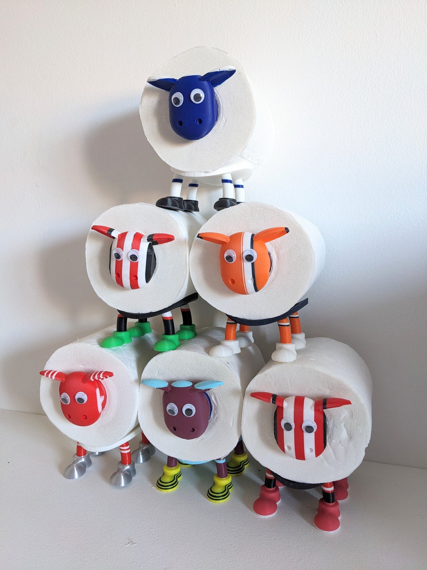 Brentford supporting Premier Sheep spare toilet roll holder with customised choice of the Bees football boots