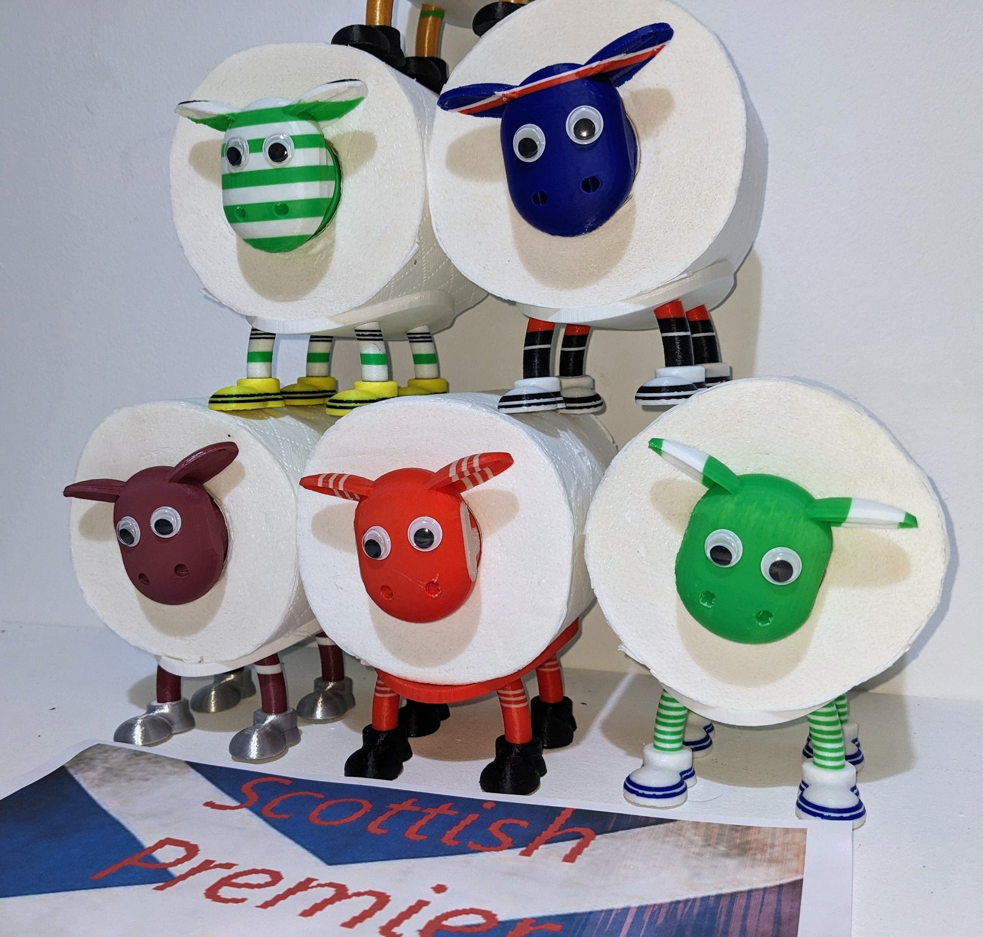 Hibernian FC Scottish Premier Sheep toilet roll holder with the Hibbies customised football boots and hibs pin badge holder.