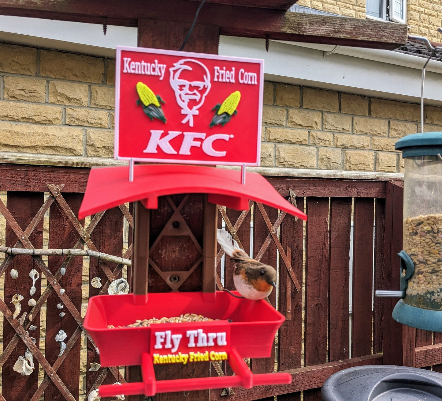 K F C Fly Thru 3d printed bird feeding station. Kentucky fried Corn feeder table for all your feathered friends into fast food takeaways.