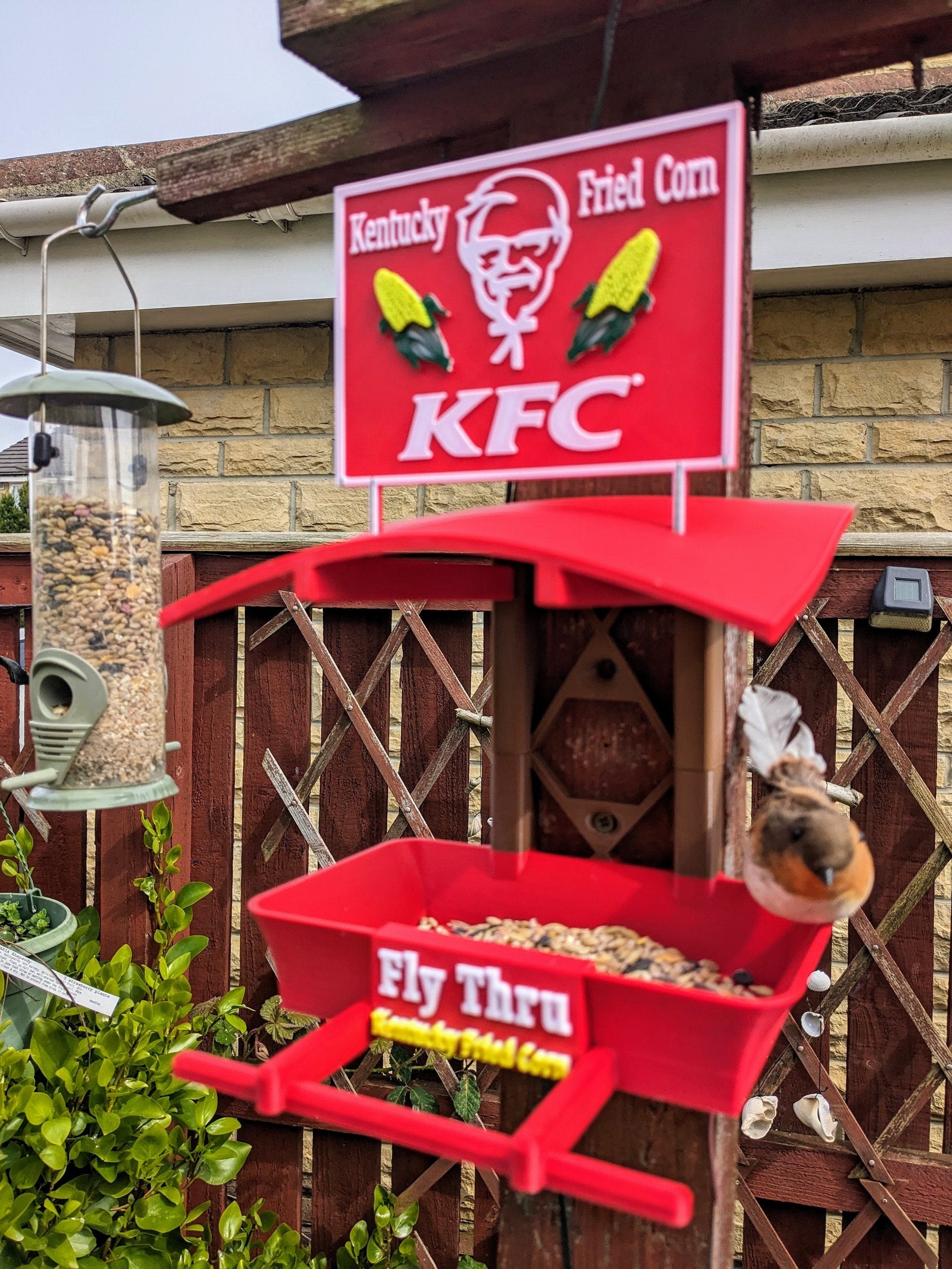 K F C Fly Thru 3d printed bird feeding station. Kentucky fried Corn feeder table for all your feathered friends into fast food takeaways.