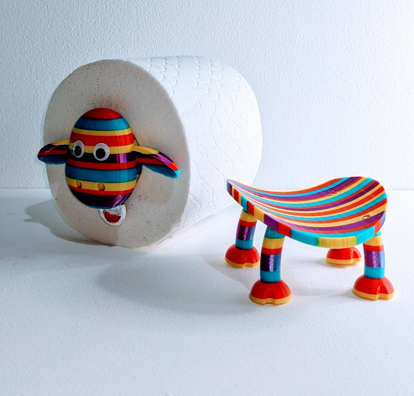 Ewe-Gene the rainbow sheep of the family spare toilet roll holder. The proudest brightest gay LGBTQ+ sheep in the flock.