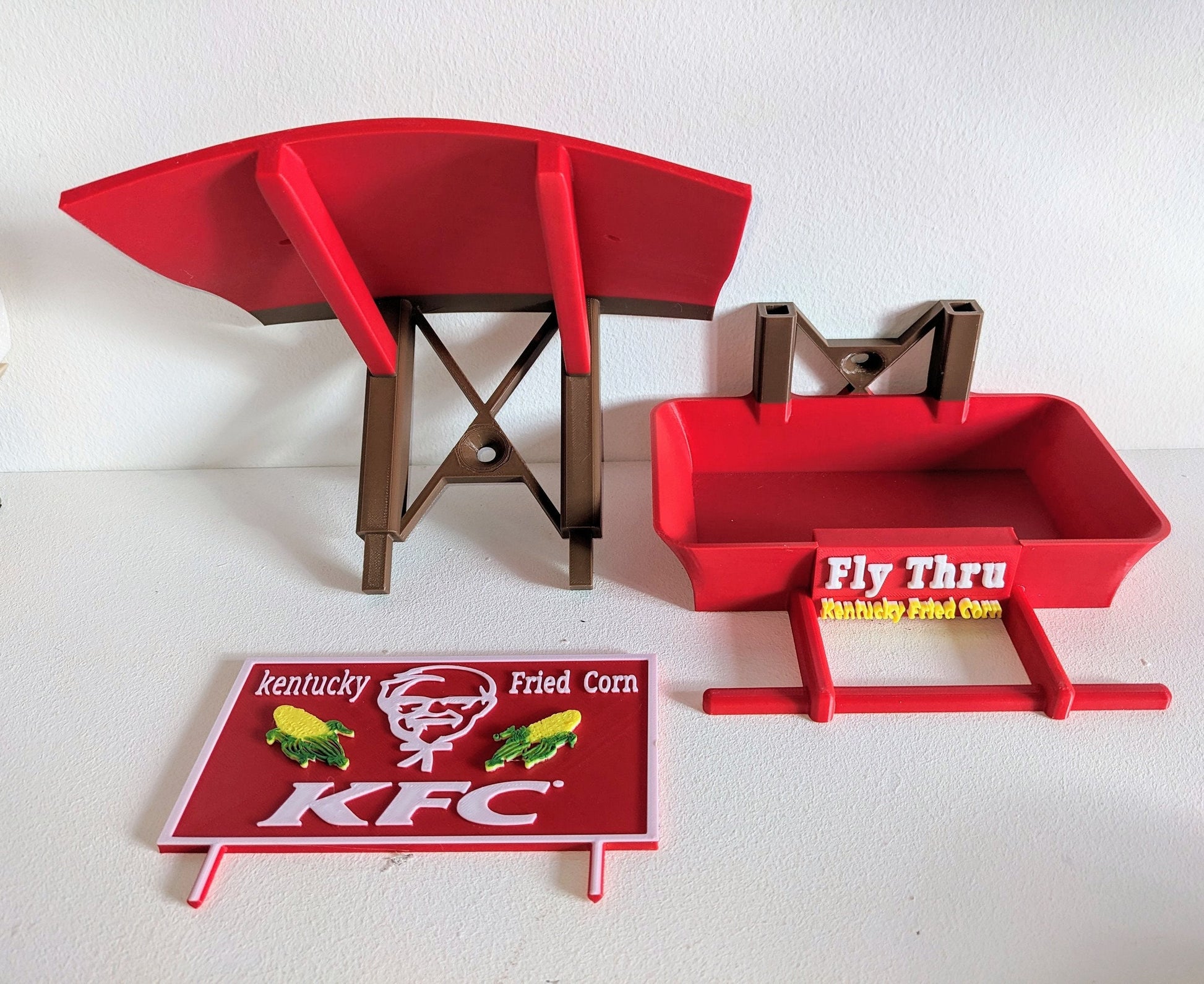 K F C Fly Thru 3d printed bird feeding station. Kentucky fried Corn feeder table for all your feathered friends into fast food takeaways.