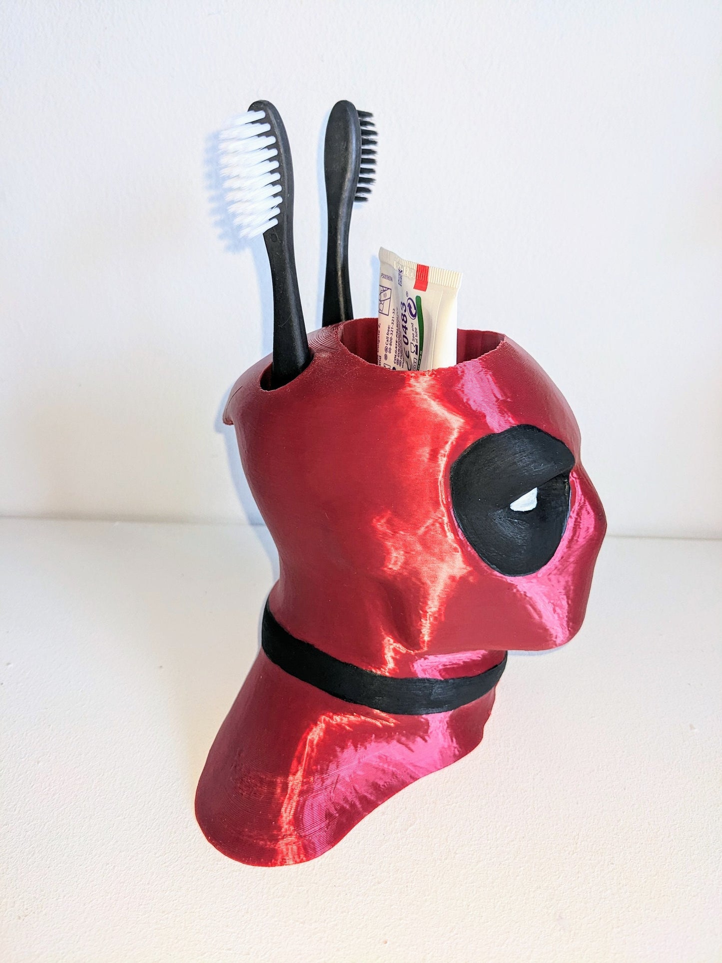 Deadpool toothbrush holder. Marvel universe collectible toothbrush or pen holder.