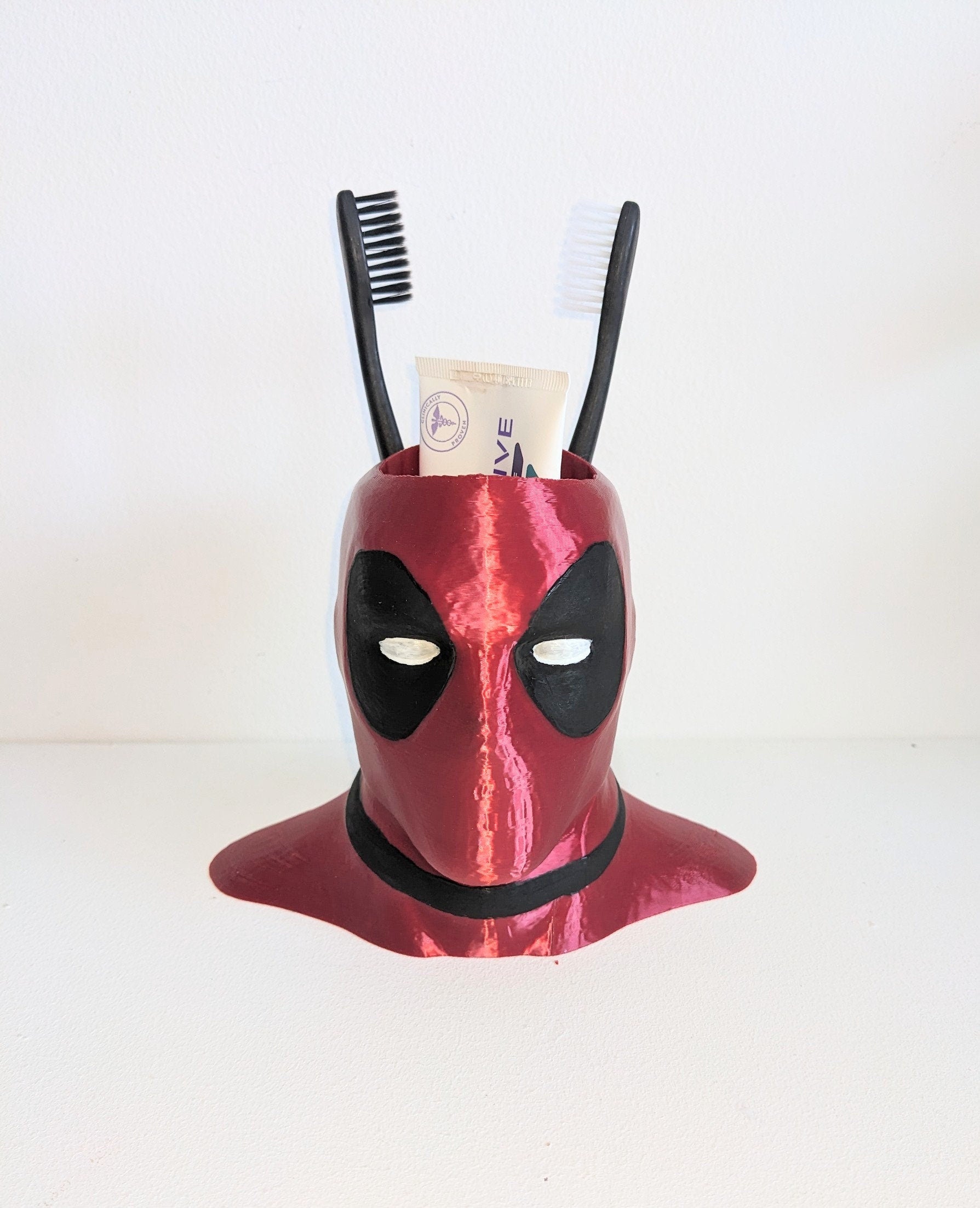 Deadpool toothbrush holder. Marvel universe collectible toothbrush or pen holder.