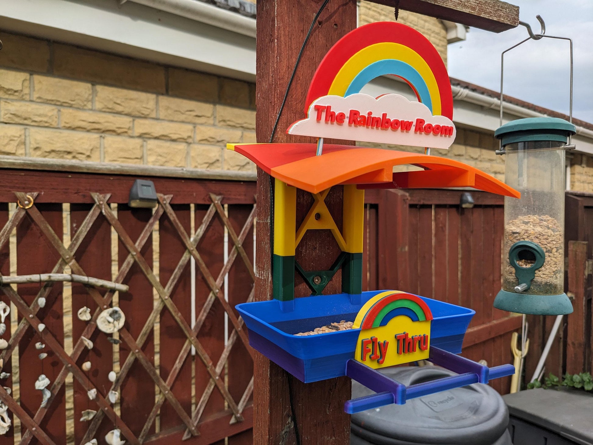 The Rainbow Room 3d printed bird feeding station. The coolest and possibly only LGBTQIA+ rainbow themed bird food table you will ever see.