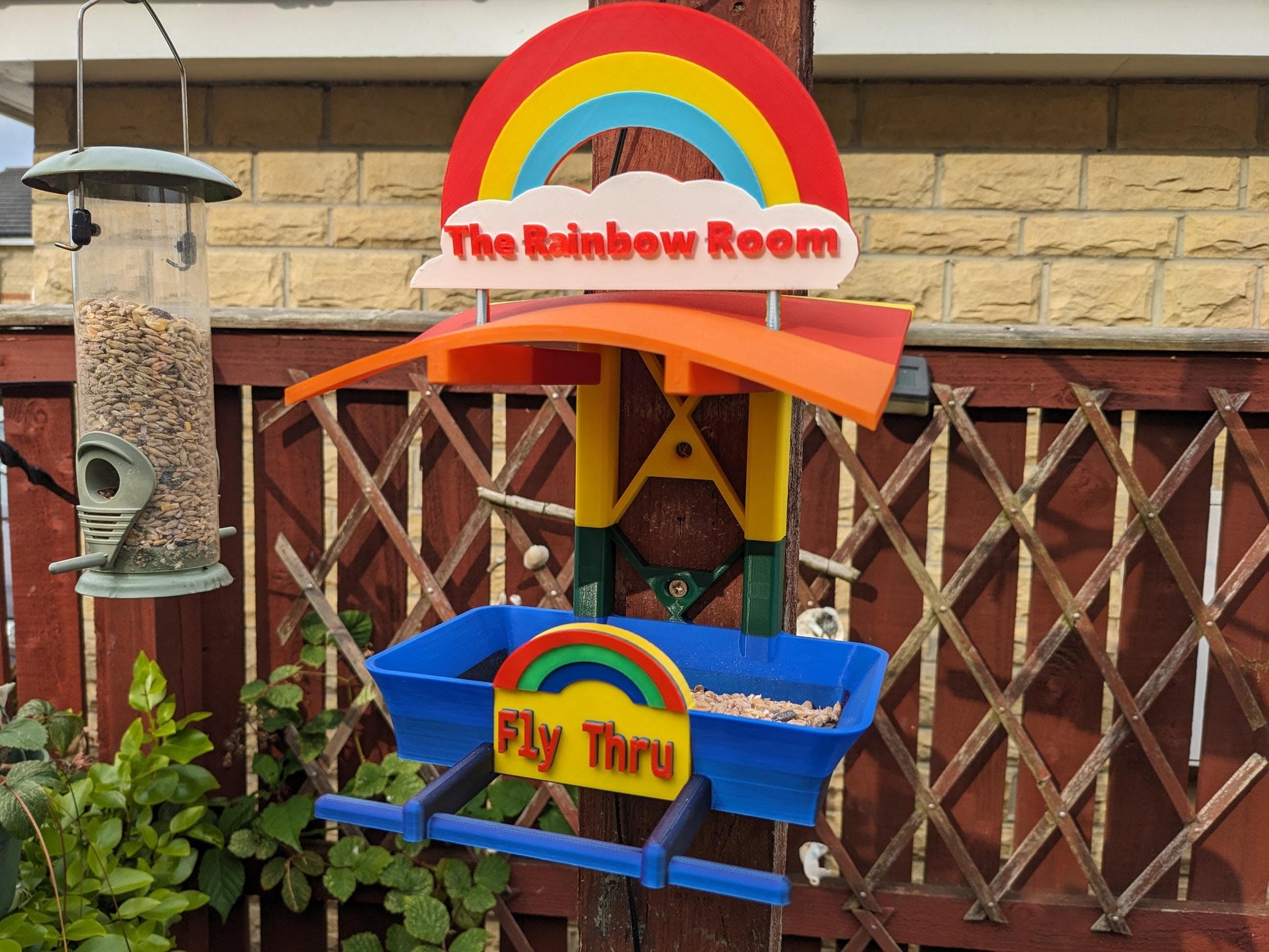 The Rainbow Room 3d printed bird feeding station. The coolest and possibly only LGBTQIA+ rainbow themed bird food table you will ever see.