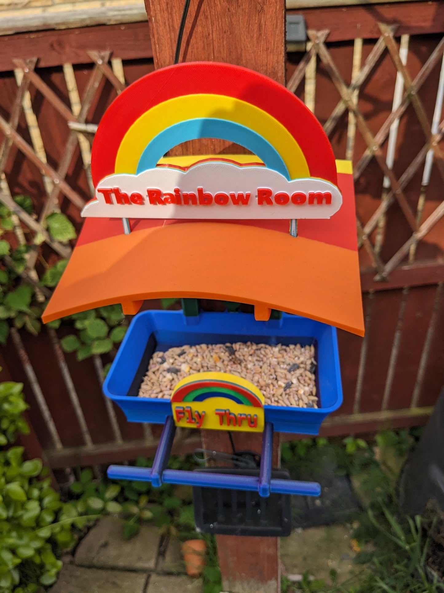 The Rainbow Room 3d printed bird feeding station. The coolest and possibly only LGBTQIA+ rainbow themed bird food table you will ever see.