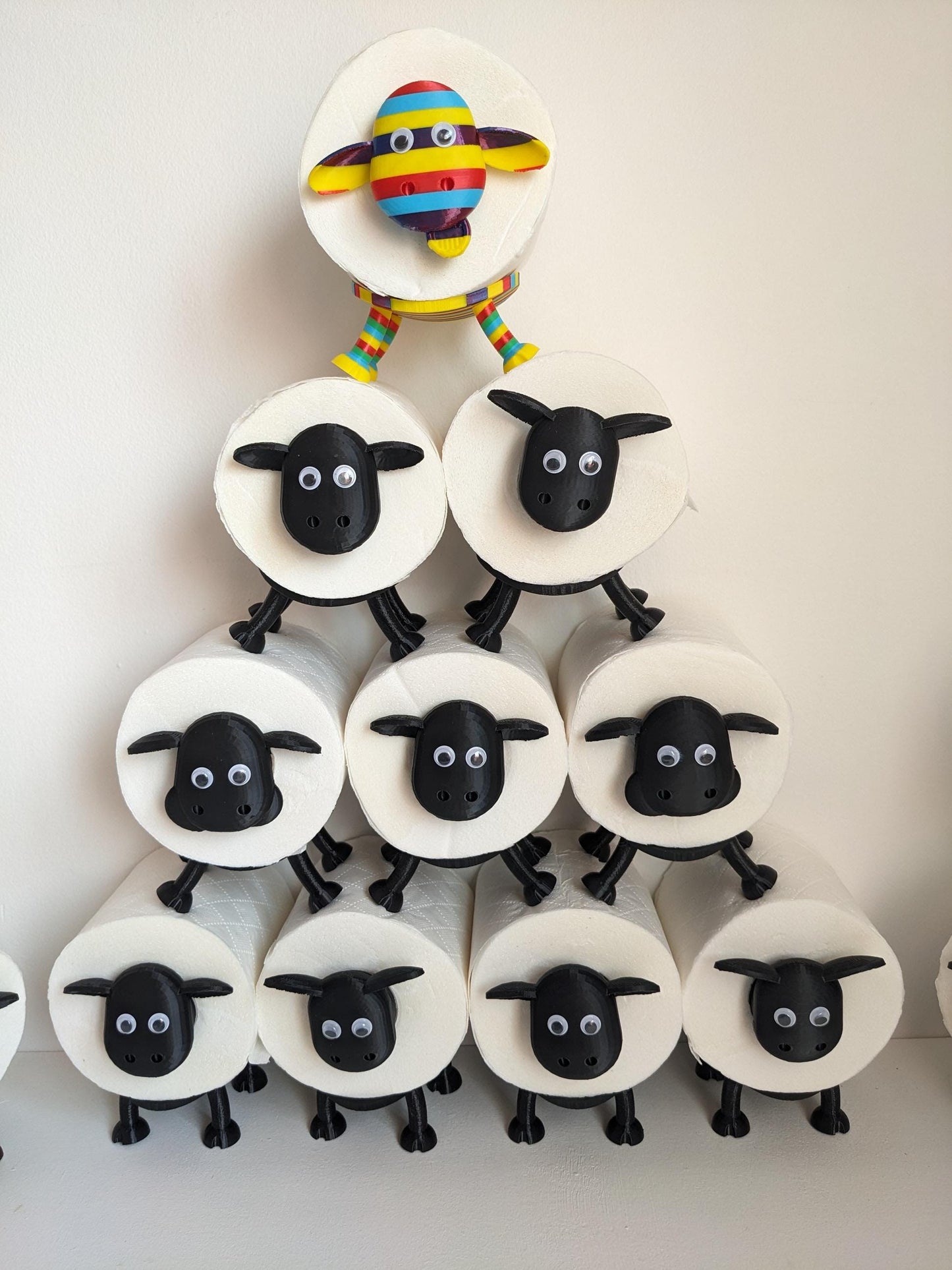 Ewe-Gene the rainbow sheep of the family spare toilet roll holder. The proudest brightest gay LGBTQ+ sheep in the flock.