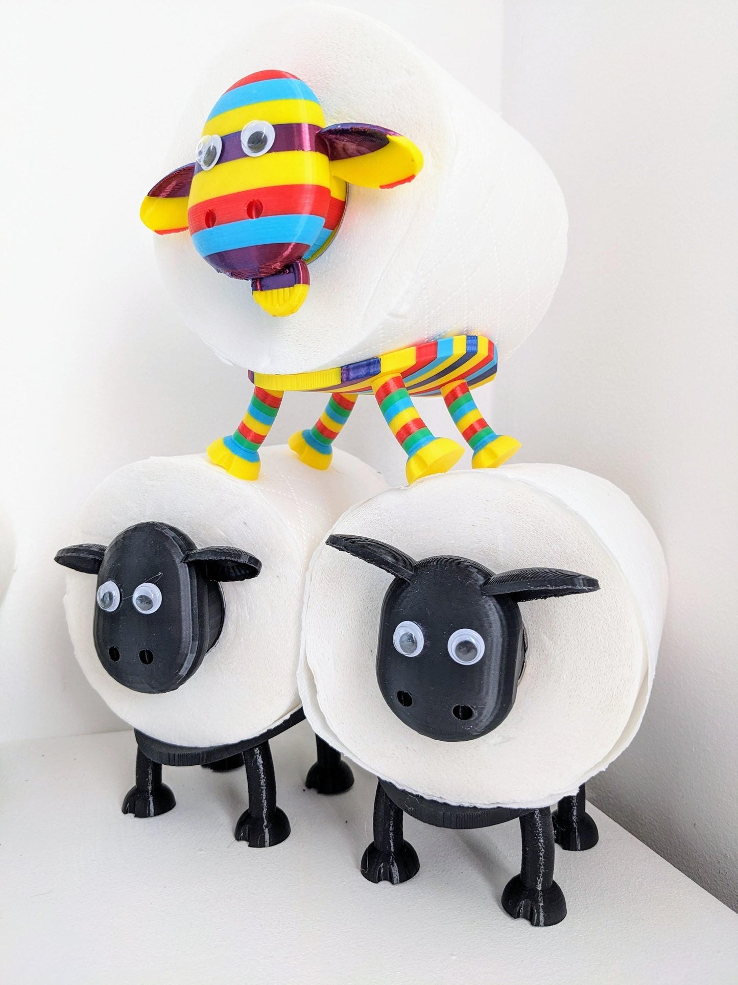 Ewe-Gene the rainbow sheep of the family spare toilet roll holder. The proudest brightest gay LGBTQ+ sheep in the flock.