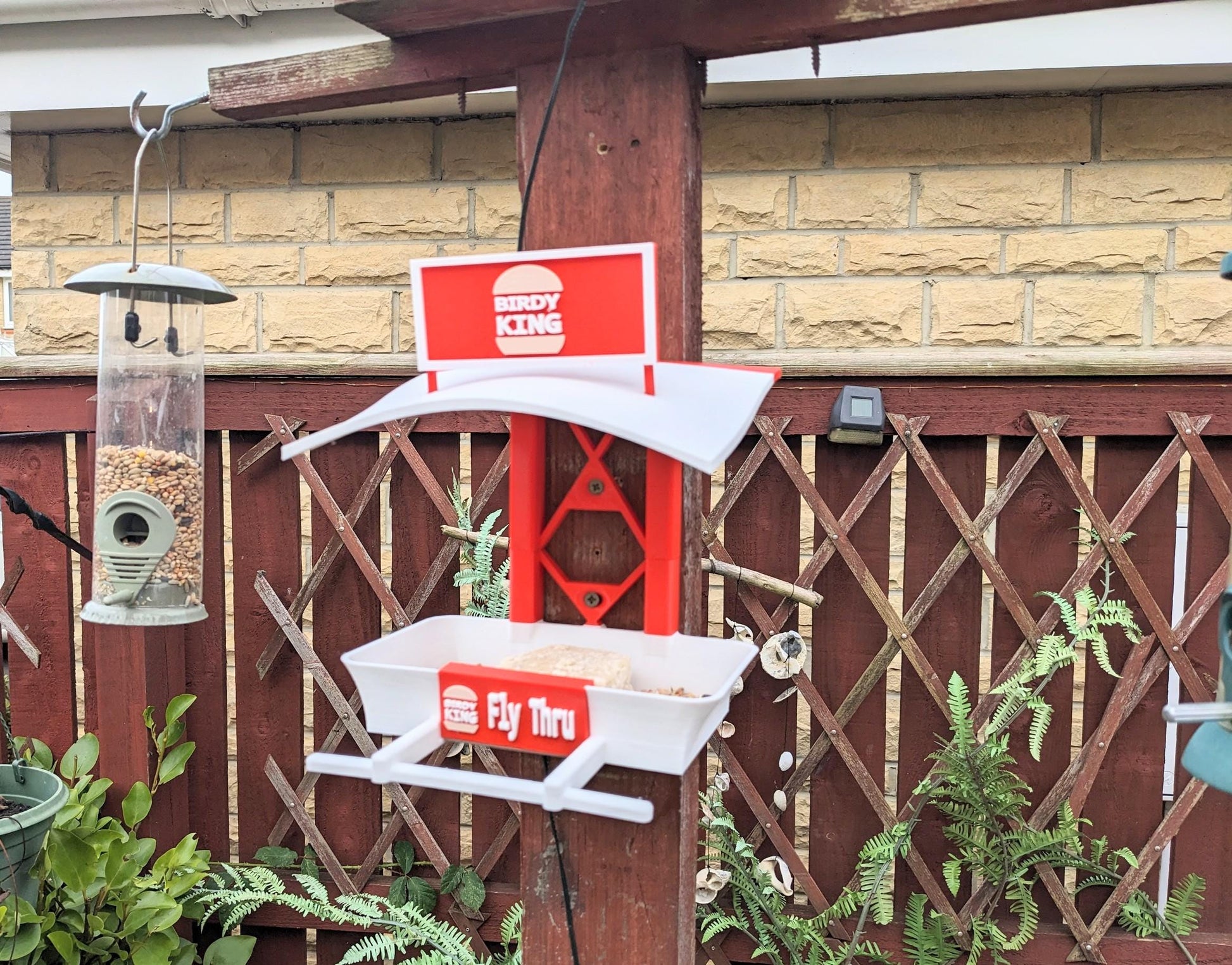 Grebes Fly Thru 3d printed bird feeding station. The coolest feeder table takeaway in town for your feathered friends. Seed, Fat ball