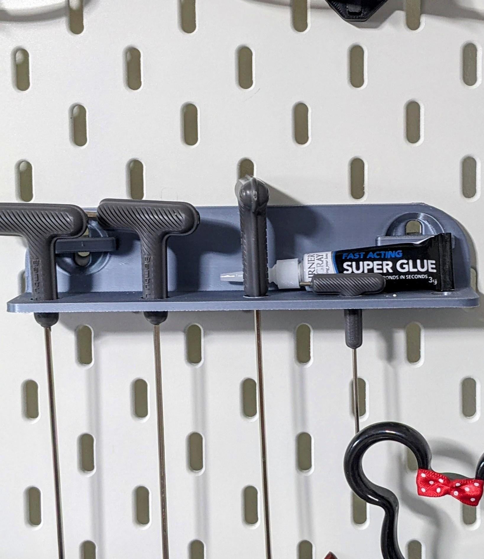 Skadis compatible screwdriver tool holder. Heavy duty mini shelf with 5 holes for Ikea pegboard.