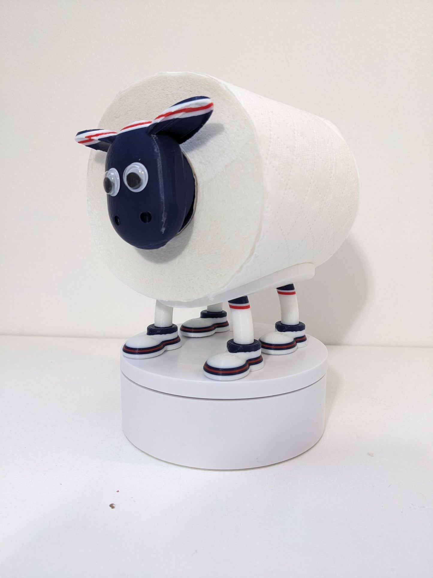 Dundee Scottish Premier Sheep toilet roll holder. 2025 Home shirt with the dees customised football boots.