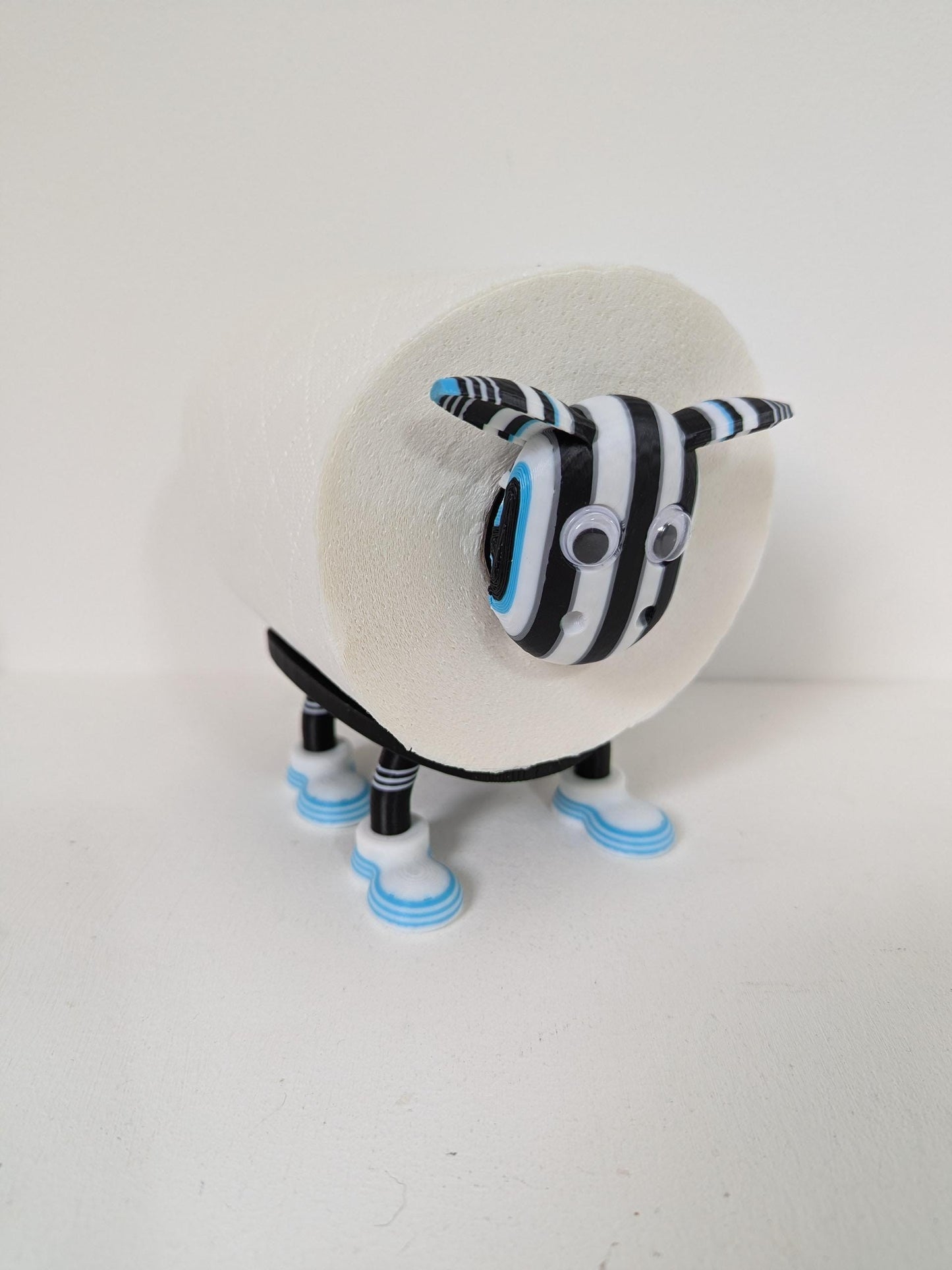 Premiersheep Newcastle United Toilet roll holder featuring the "Shepherds Check" and "Greggs blue" trim for the 2025/26 season Universal fit